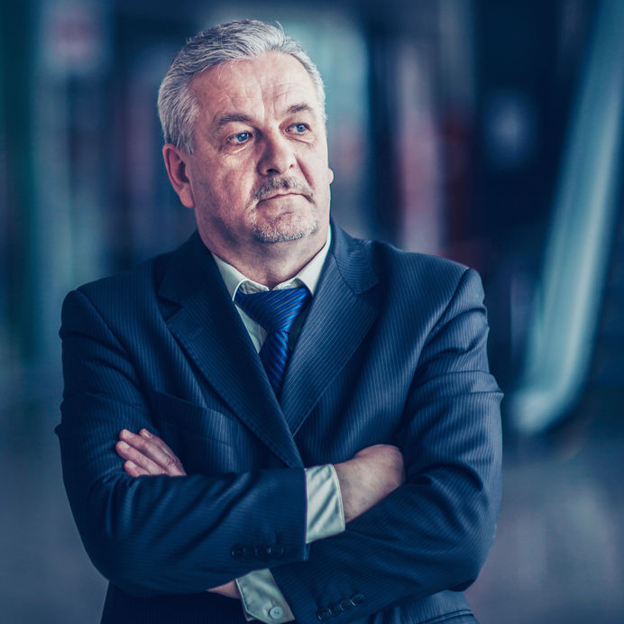 portrait of a successful businessman on background of modern off