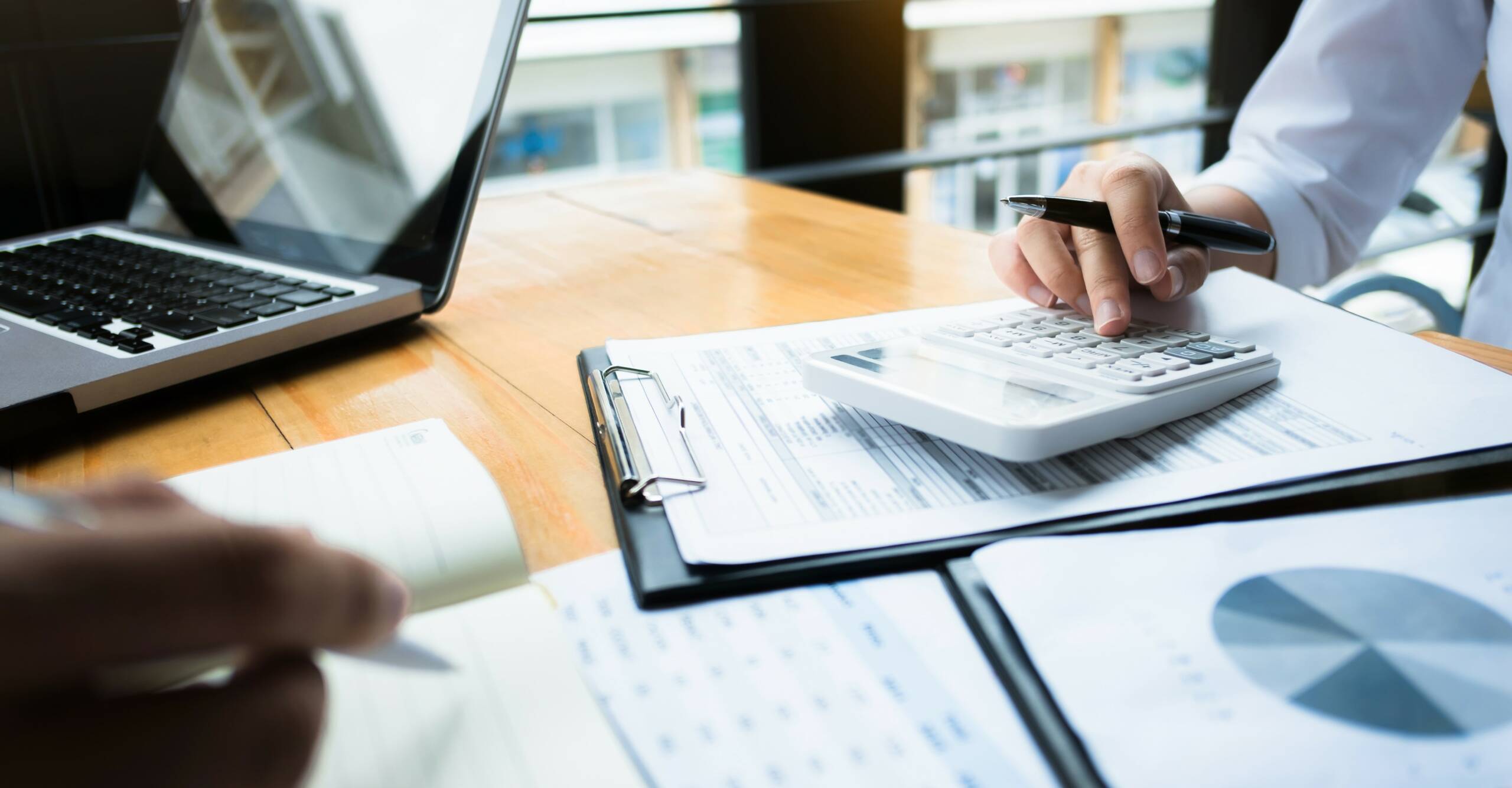 business audits using a calculator financial data investment fund at a workplace, wealth concept